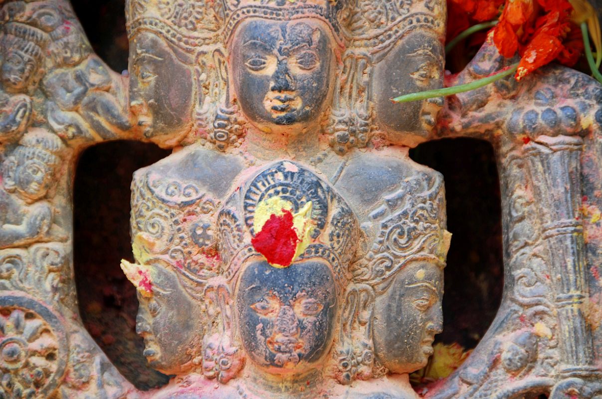 Kathmandu Changu Narayan 10-2 10-Headed Vishnu Stone Statue Close Up Here is a close up of six of the 10 heads of the 10-headed Vishnu at Changu Narayan Temple in the Kathmandu Valley.